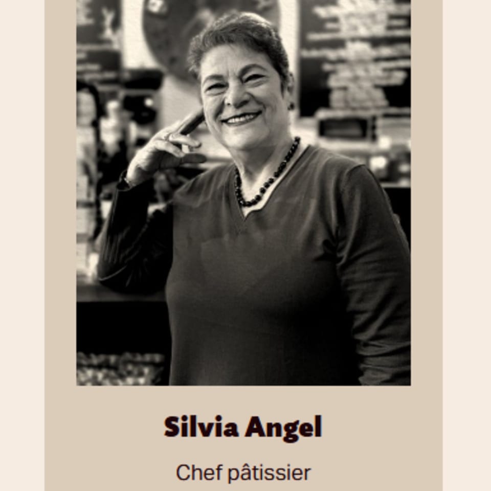 Black and white portrait of Silvia Angel, Bolivar Coffee's Chef Pâtissier, smiling warmly.