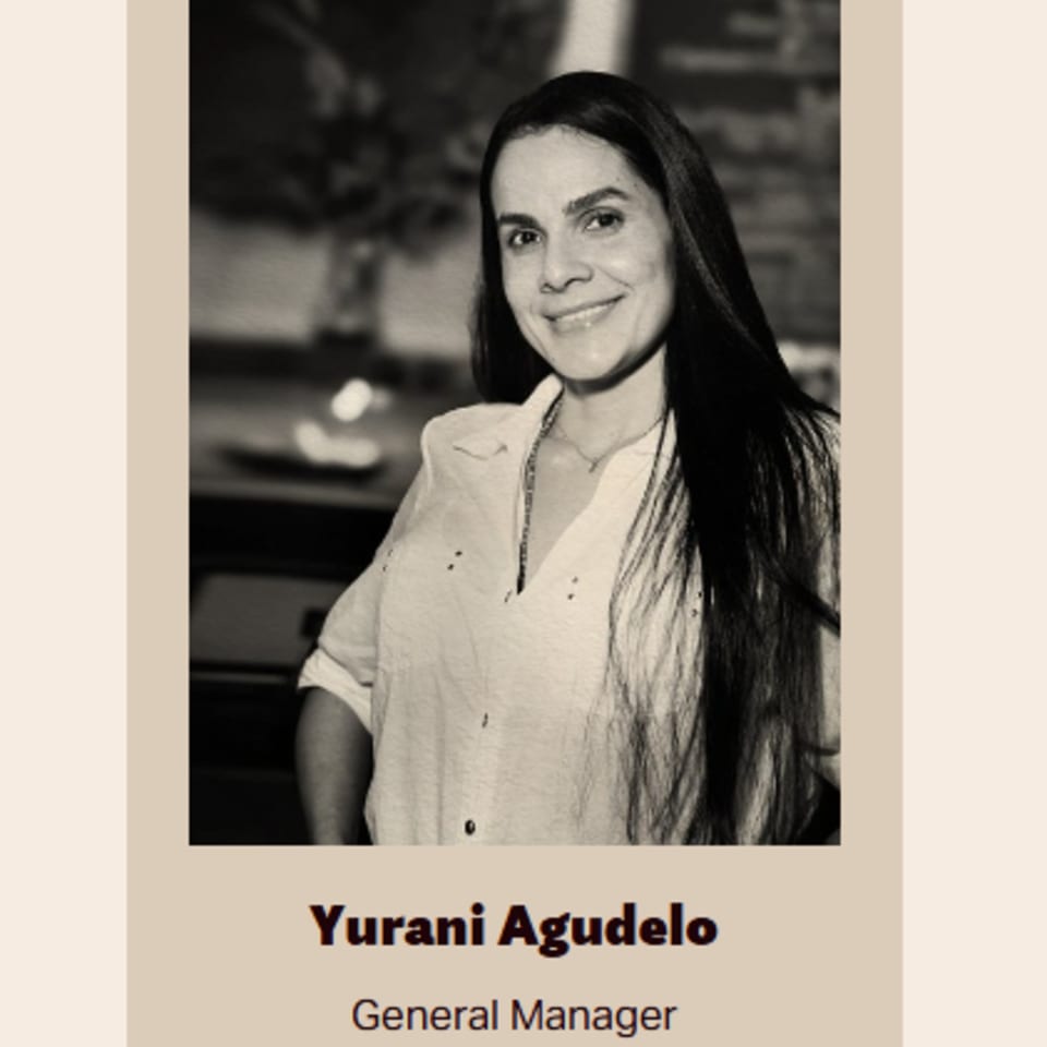 Black and white portrait of Yurani Agudelo, Bolivar Coffee's General Manager, smiling.