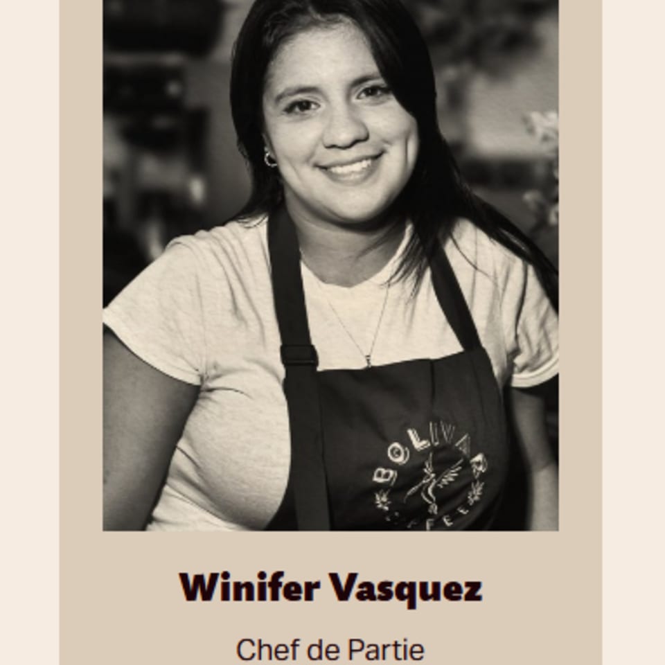 Winifer Vasquez, a smiling Chef de Partie at Bolivar Coffee, wearing an apron.