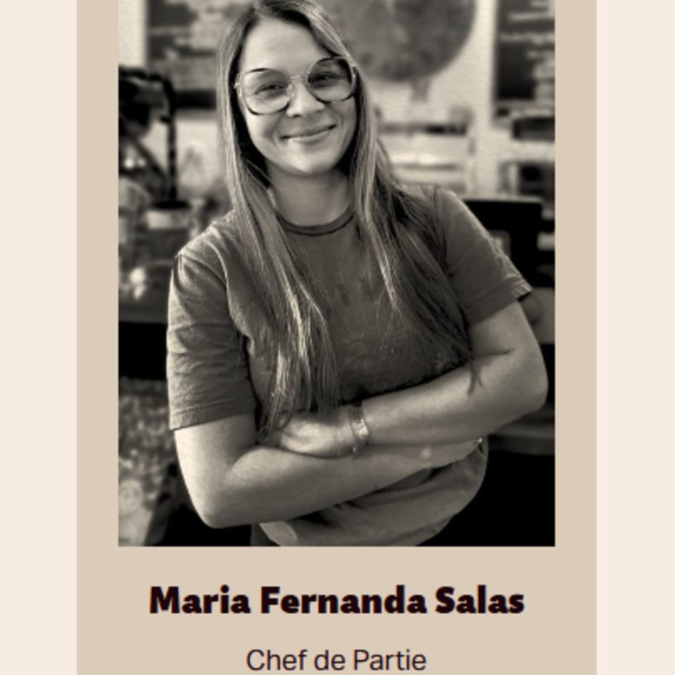 Black and white portrait of Maria Fernanda Salas, Chef de Partie, smiling with arms crossed.